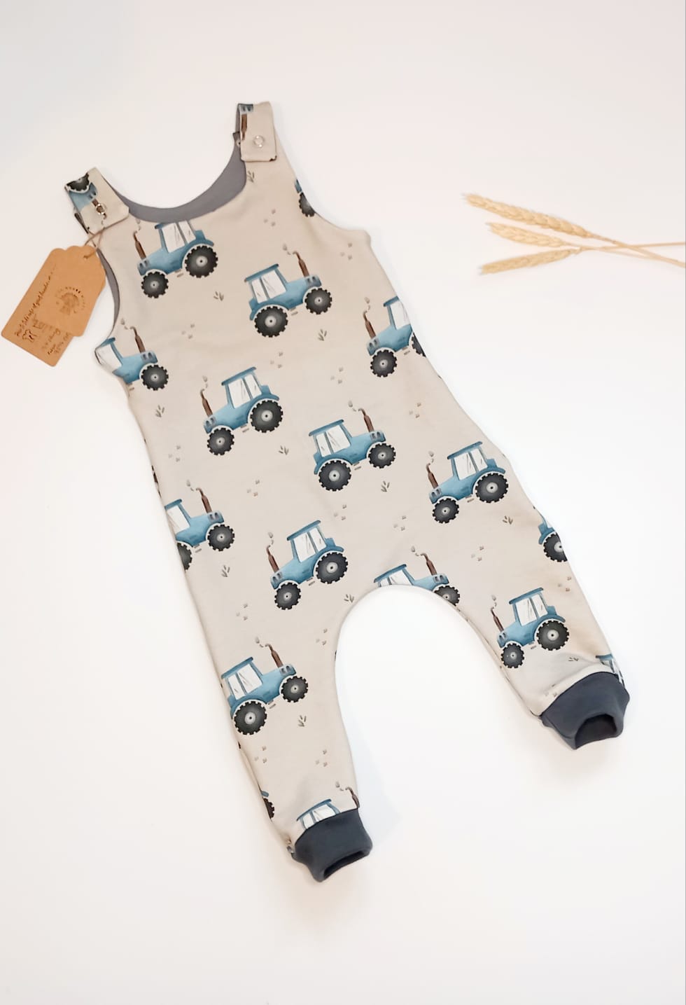 Blue tractor dungaree romper