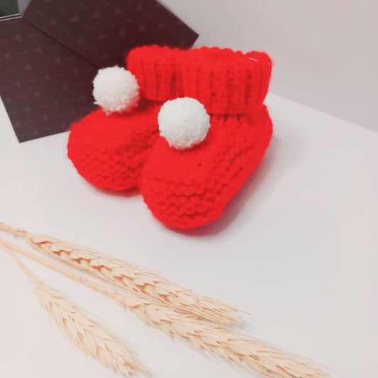 Hand knitted bootees (Red and white pom pom)